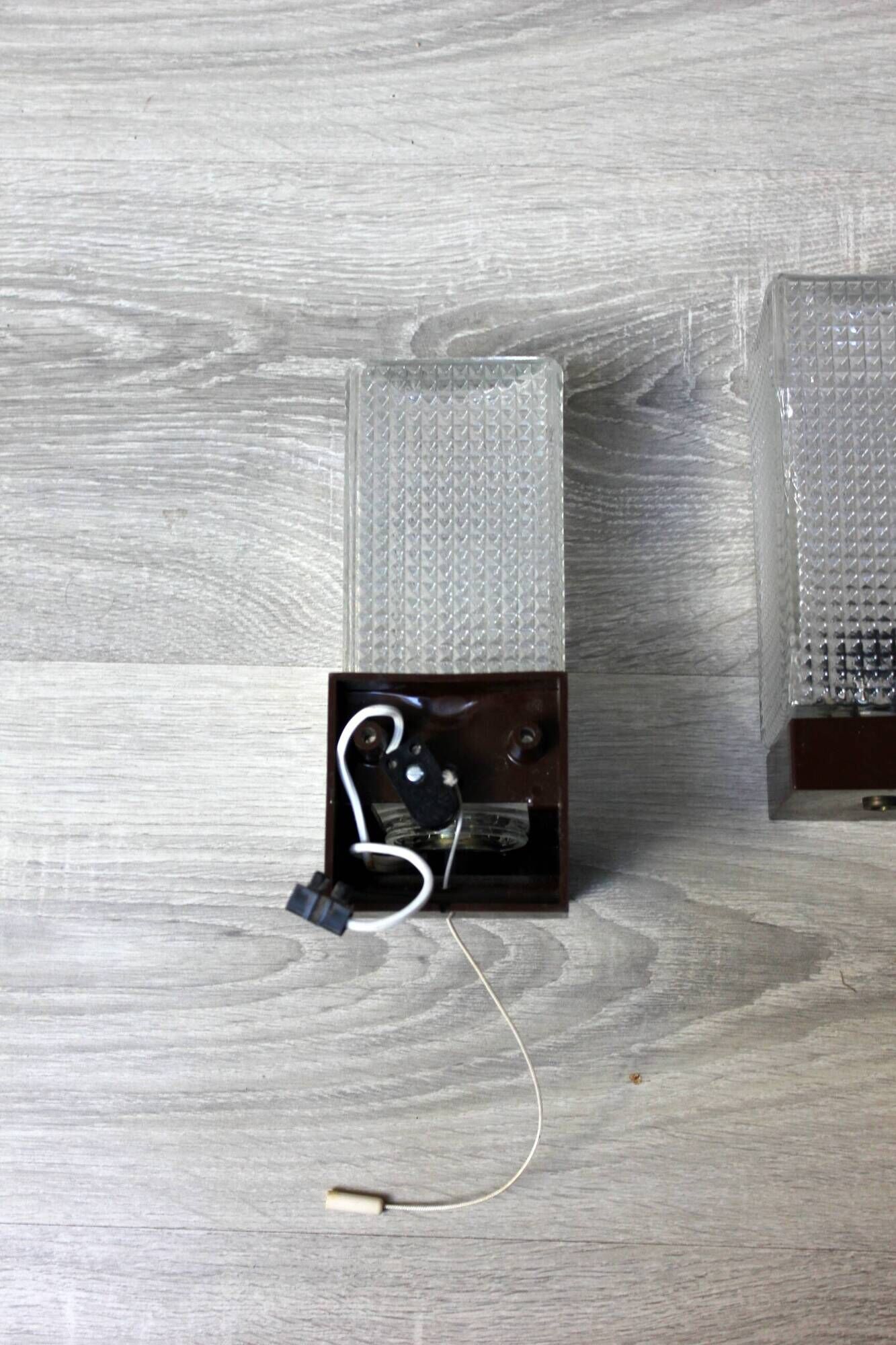 Pair of vintage wall sconces with etched glass and pull switch from the 1970s.