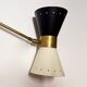Articulated brass and lacquered iron wall light, 1950s design.