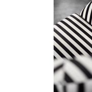 Mid-century modern Scandinavian rounded armchairs with black and white stripes, 1960s.