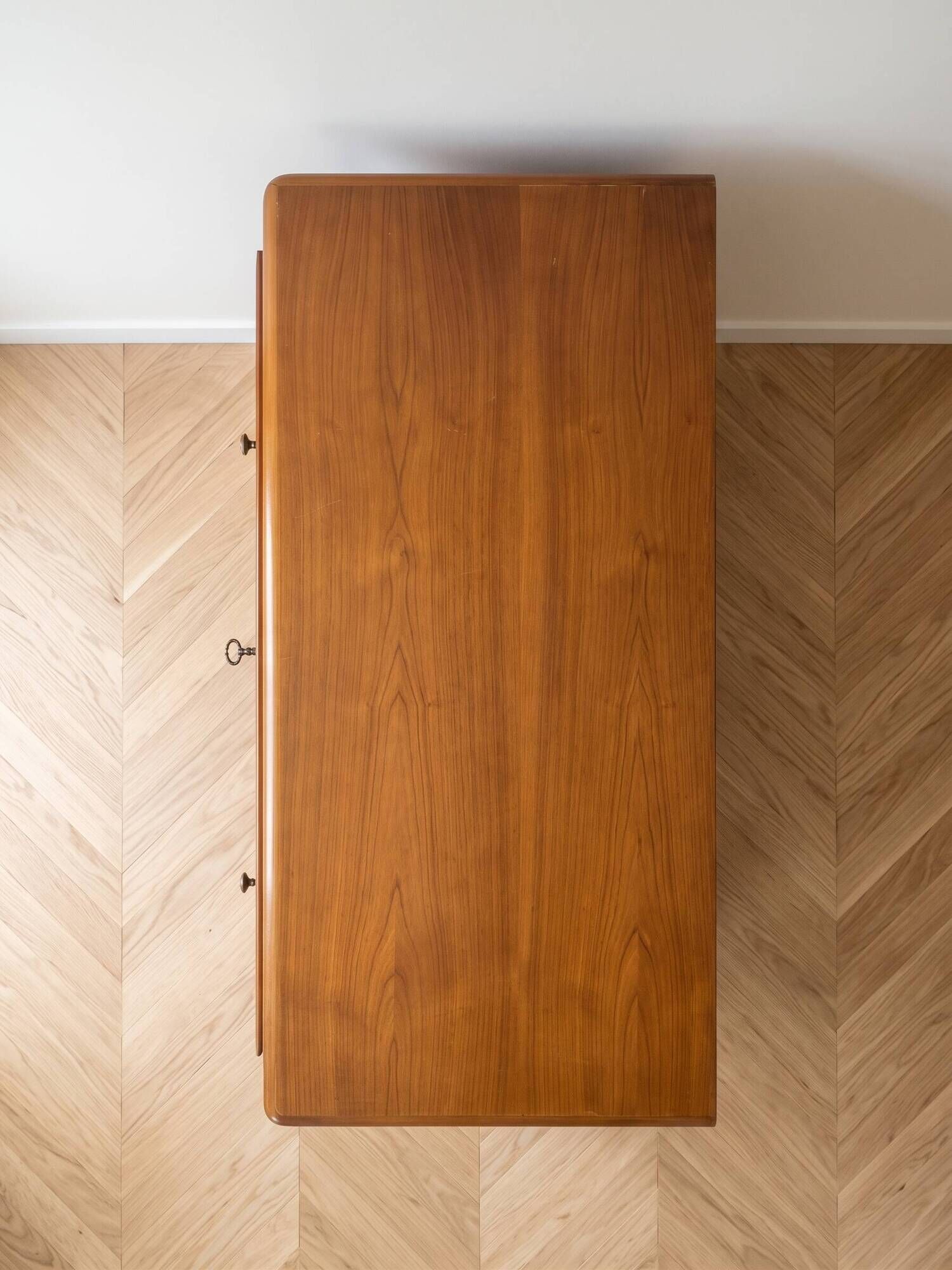 Antique solid wood chest of drawers with a secret drawer.