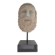 Greek god statue in stone with a marble base.
