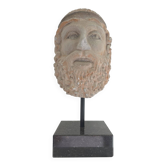 Greek god statue in stone with a marble base.