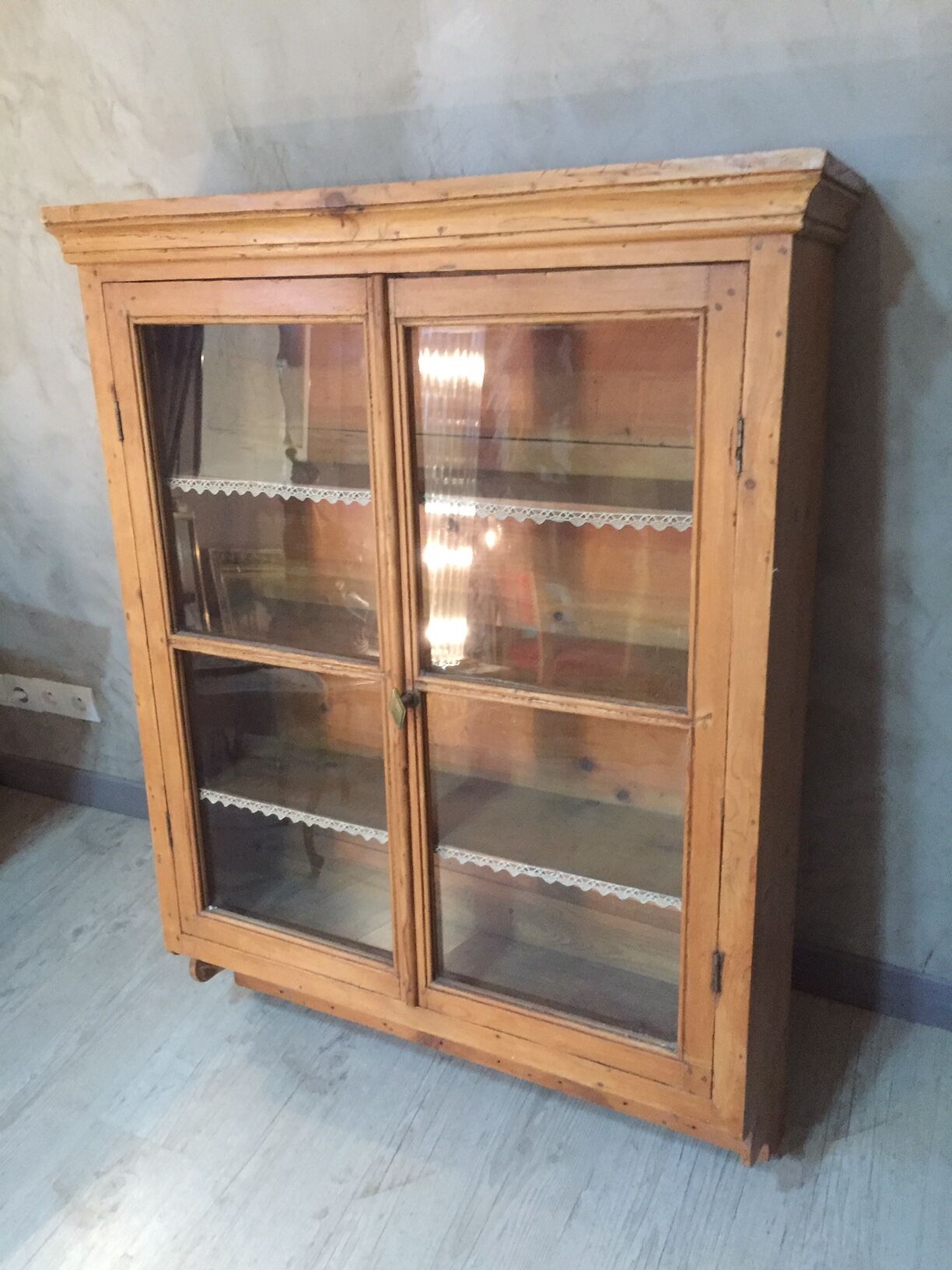 Suspended in early twentieth century tree window