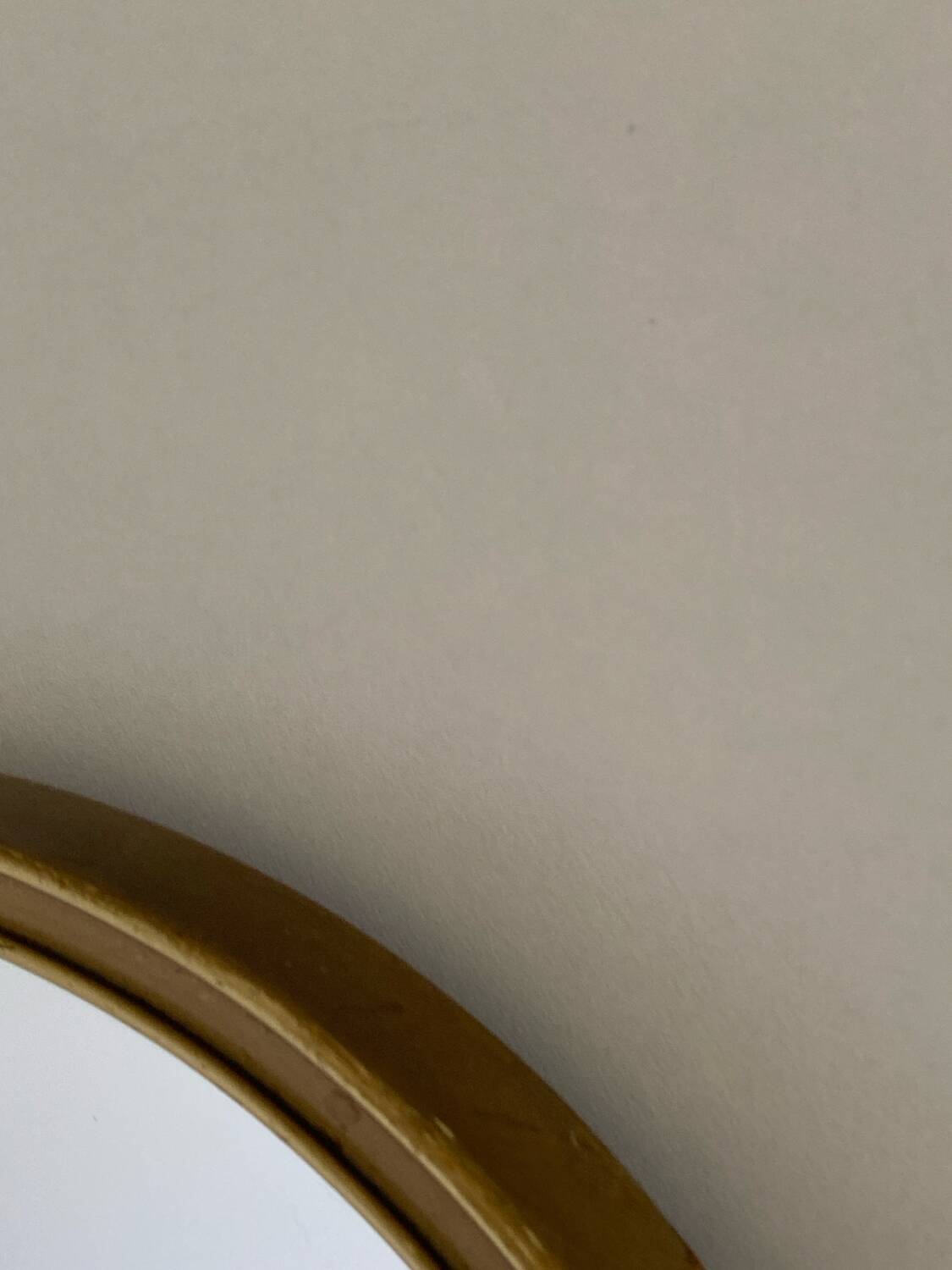 Vintage brass mirror in rear-view mirror shape