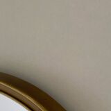 Vintage brass mirror in rear-view mirror shape