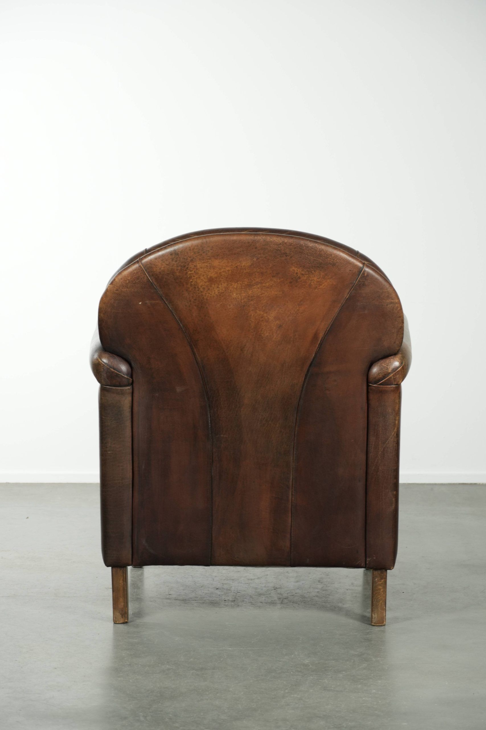 Characterful sheepskin design armchair with beautiful patina