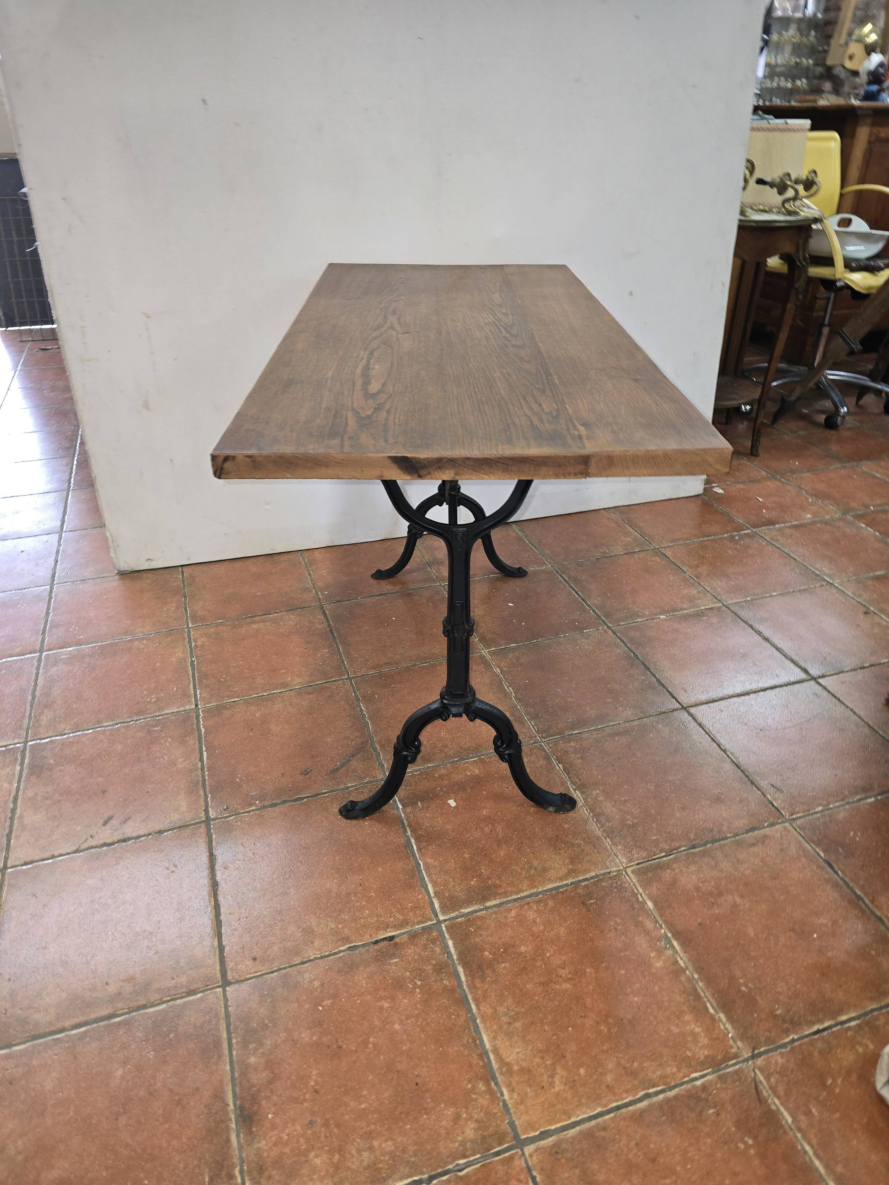 Old bistro table with oak top, cast iron base, 118 cm L