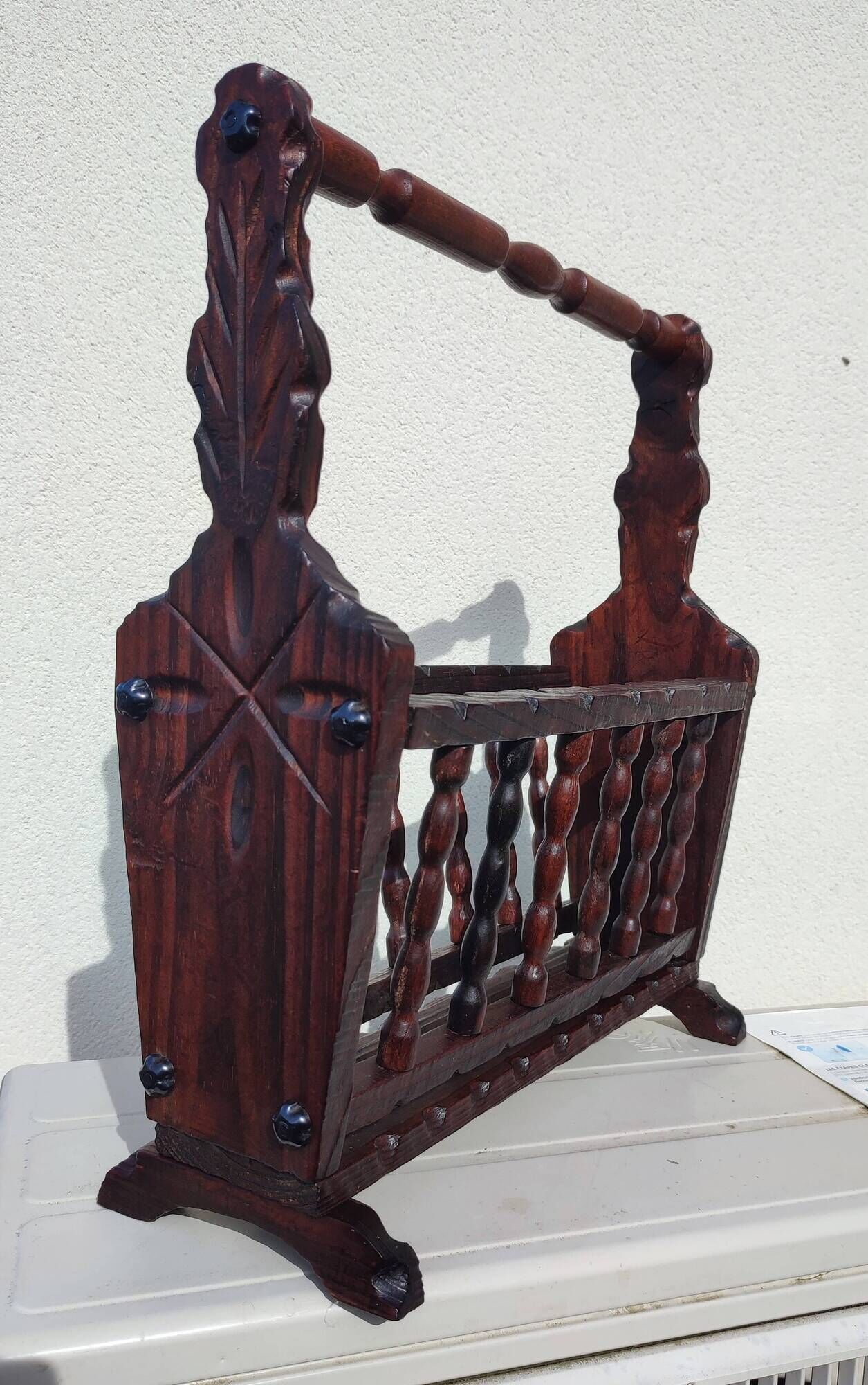 Rustic stained wooden magazine rack
