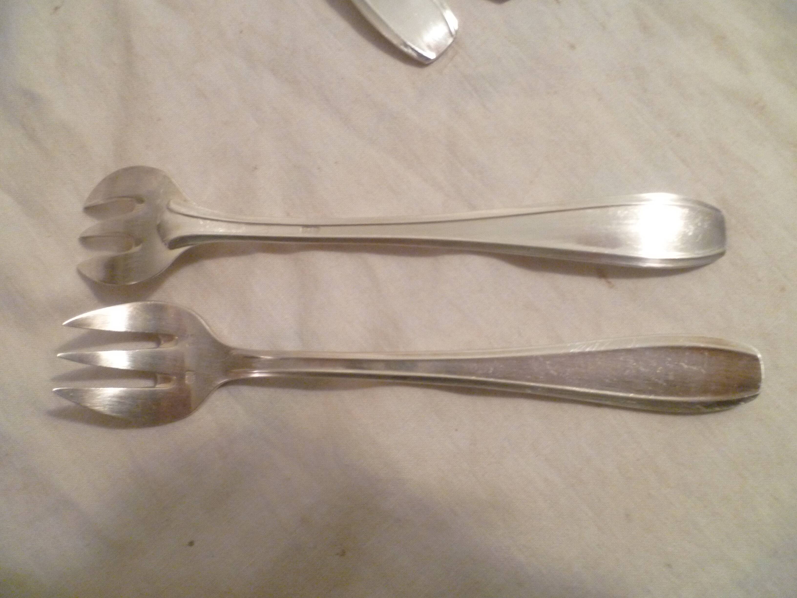 Set of 9 art deco silver oyster forks