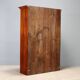 Vintage walnut wardrobe with exposed hardware.