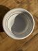 Small earthenware bowl from Italy, white with brown, green, and orange trim, D24.5.