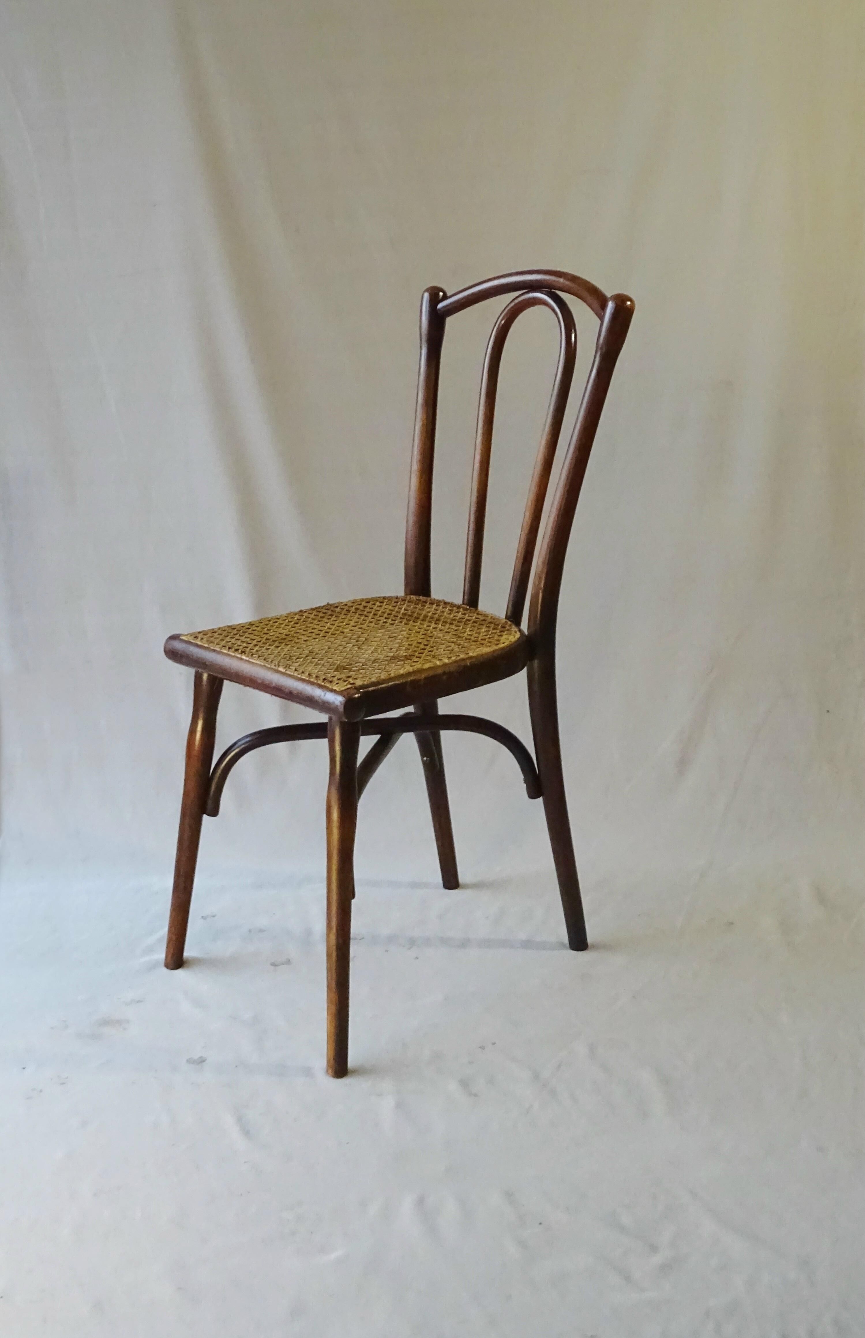 Chaise bistrot  Thonet N°118 pieds compas 1895, cannée