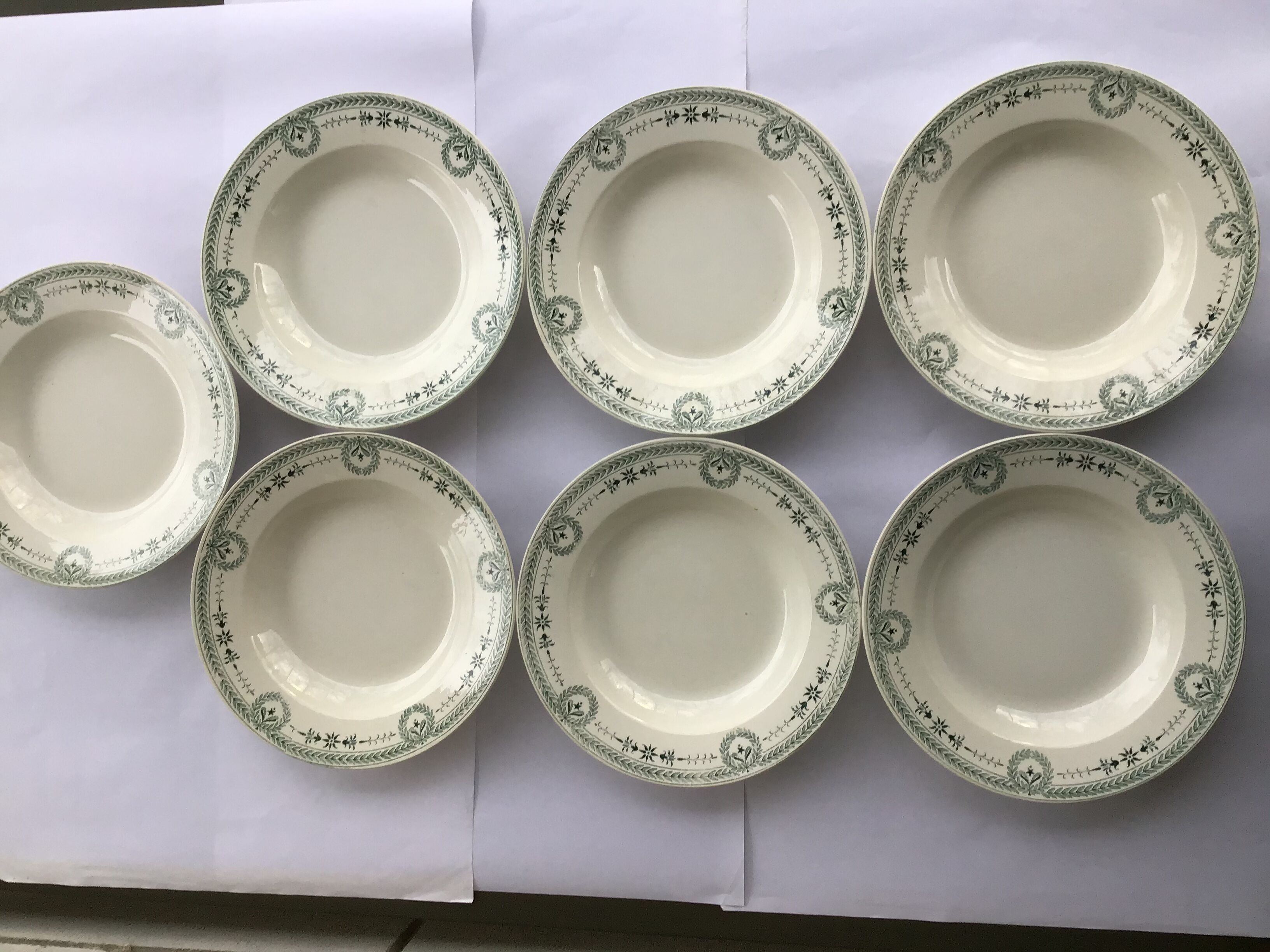 7 Old dark green Digoin hollow plates