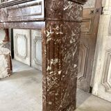 Red marble fireplace in the Louis XVI style, late 19th century