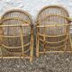 A pair of rattan armchairs