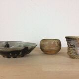 Three stoneware empty pockets with blue drips