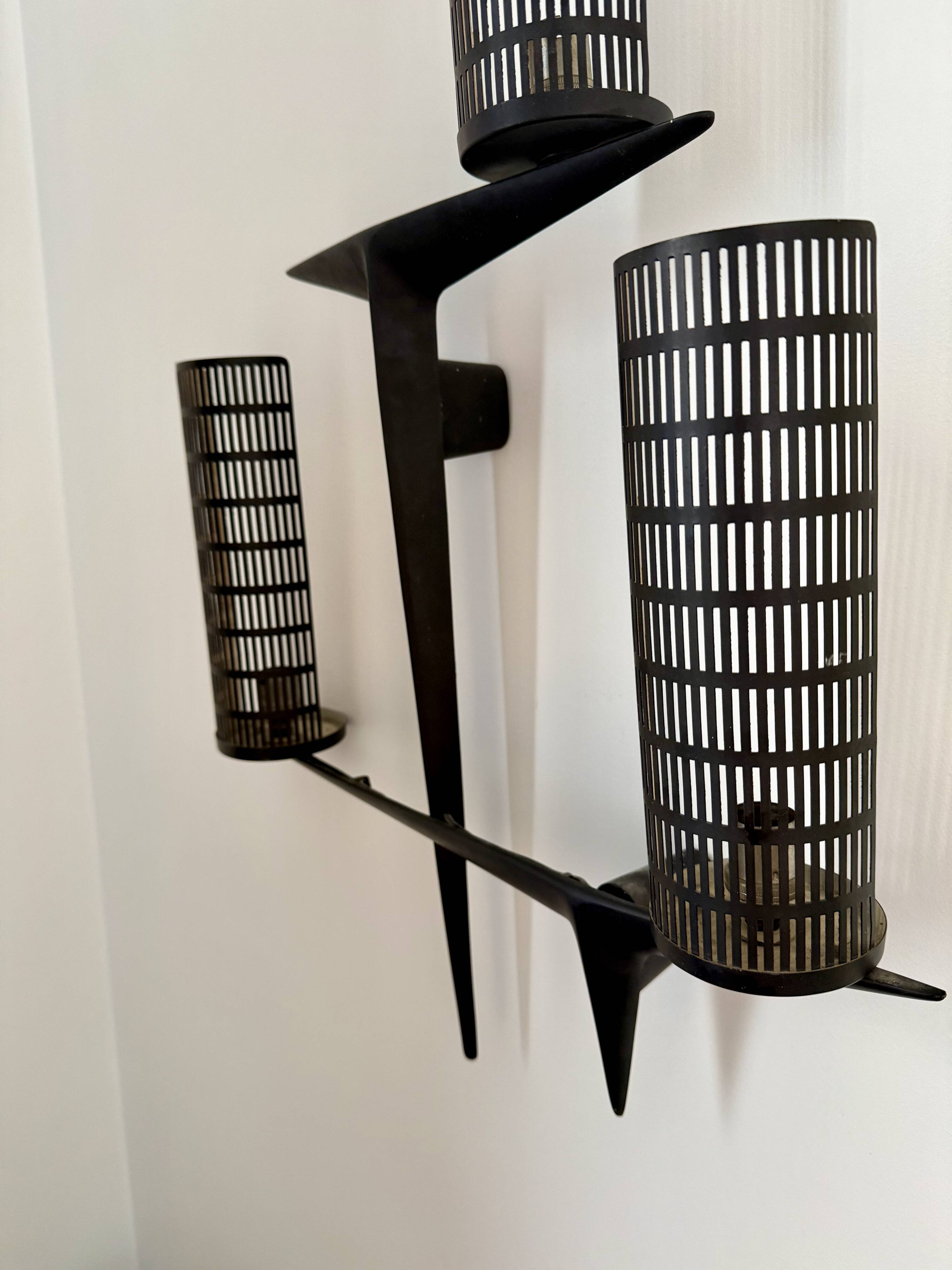 Pair of sculpted lacquered bronze wall lights, Arlus