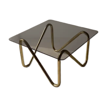 Coffee table with smoked glass and curved metal base