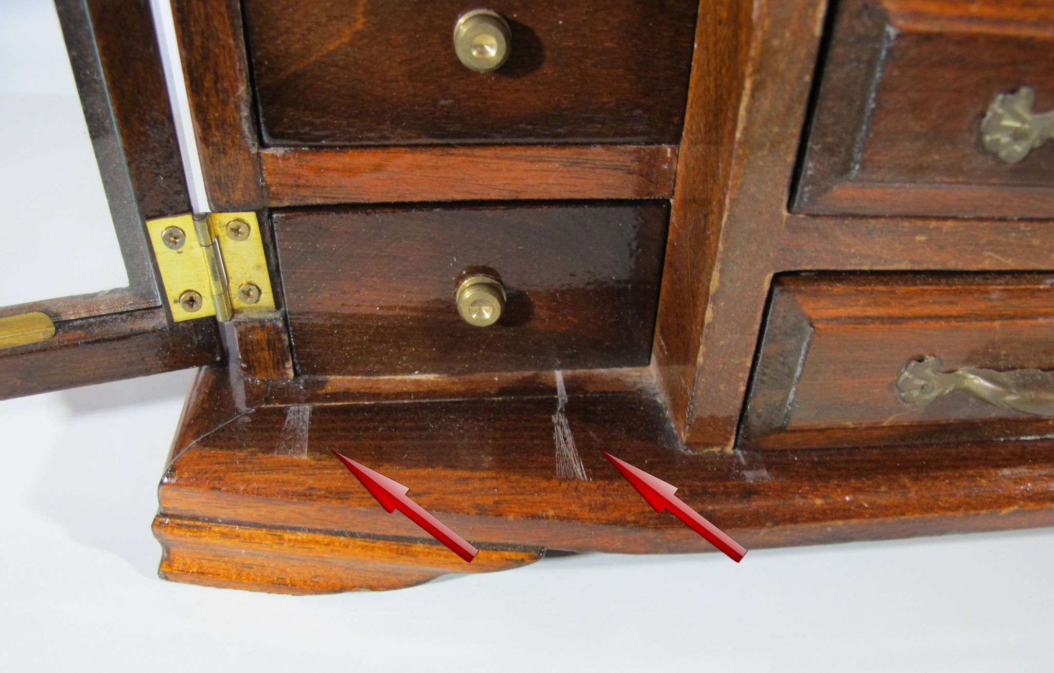 Wooden jewelry box in the shape of a dresser
