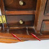 Wooden jewelry box in the shape of a dresser