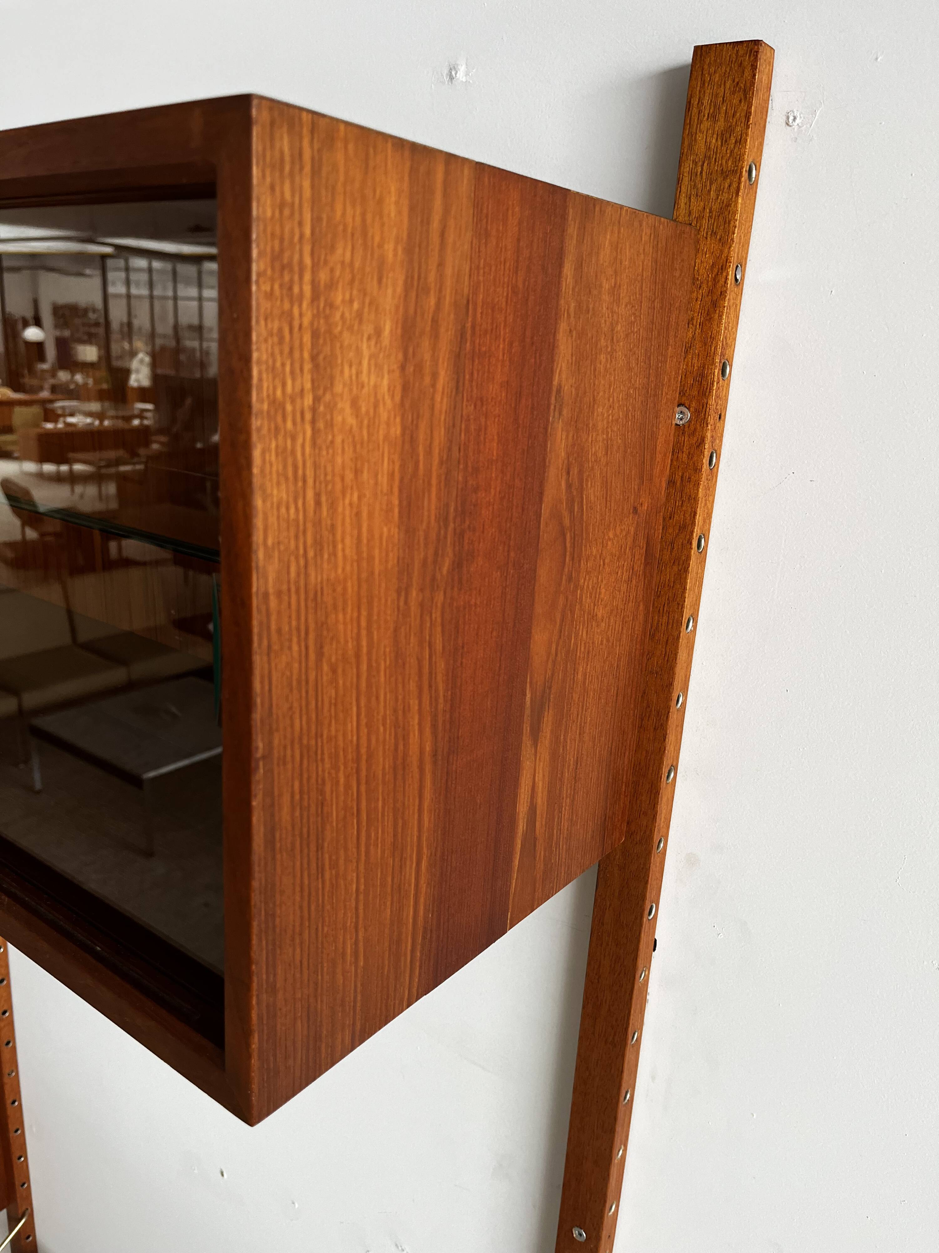 A wall unit with 4 compartments by Poul Cadovius, Denmark, 1960s.