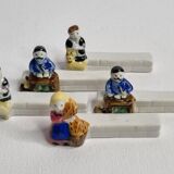 Five porcelain knife holders signed "Le Merzer", 6 cm
