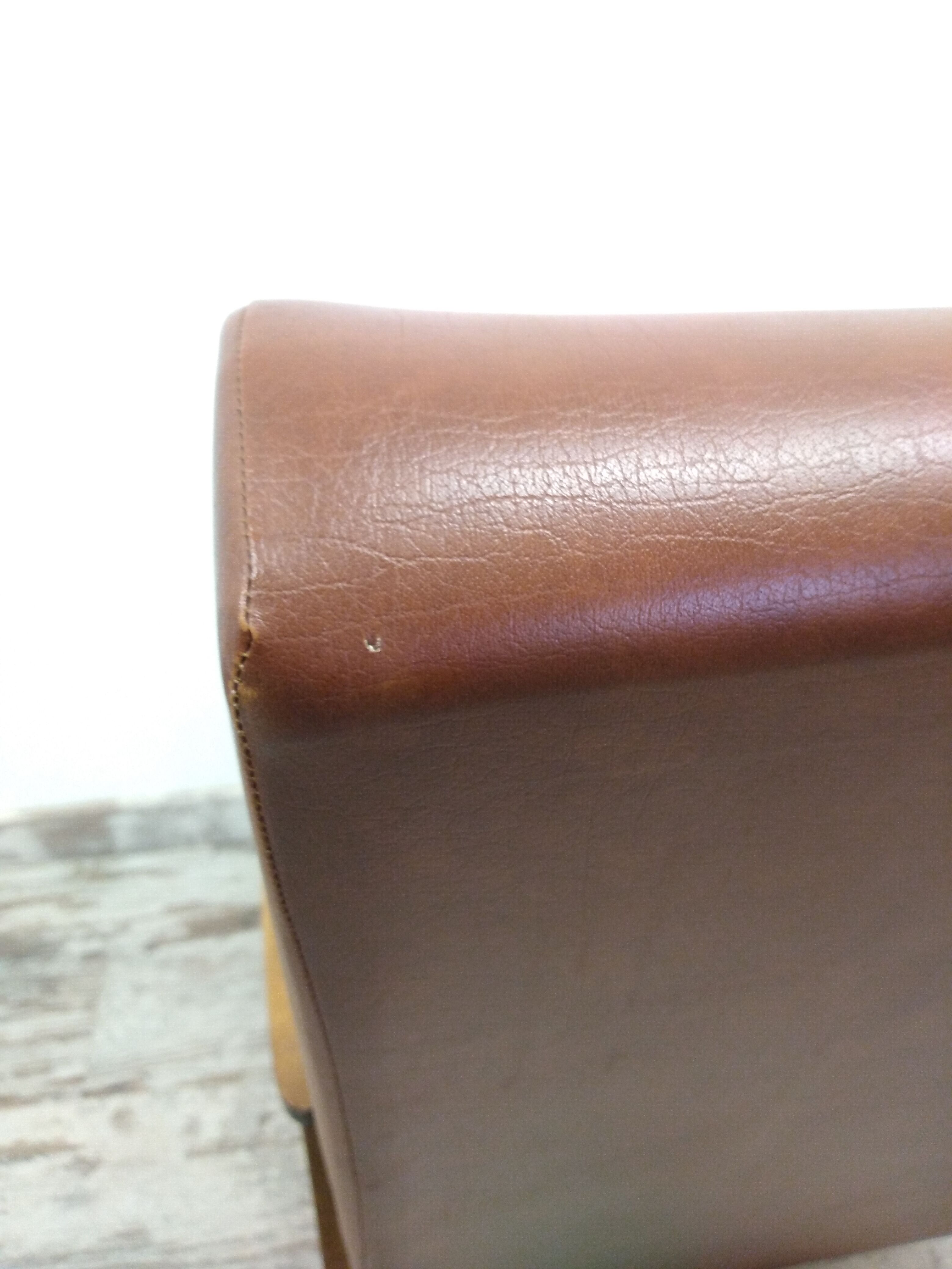 Vintage armchair in wood and imitation leather