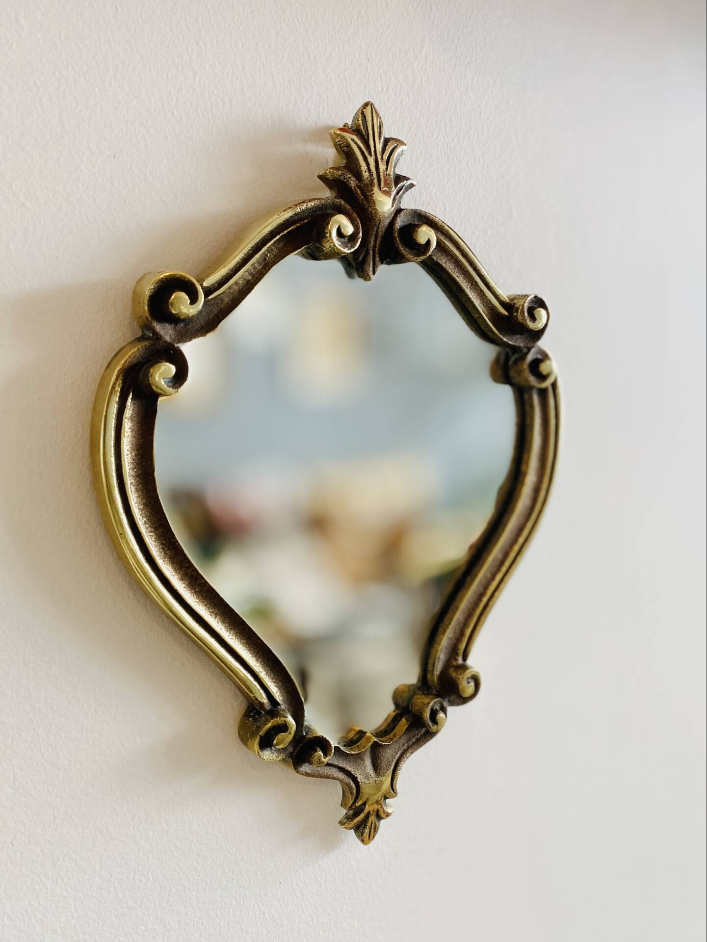 Small antique mirror in baroque style – gold frame in bronze or brass.