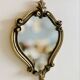 Small antique mirror in baroque style – gold frame in bronze or brass.
