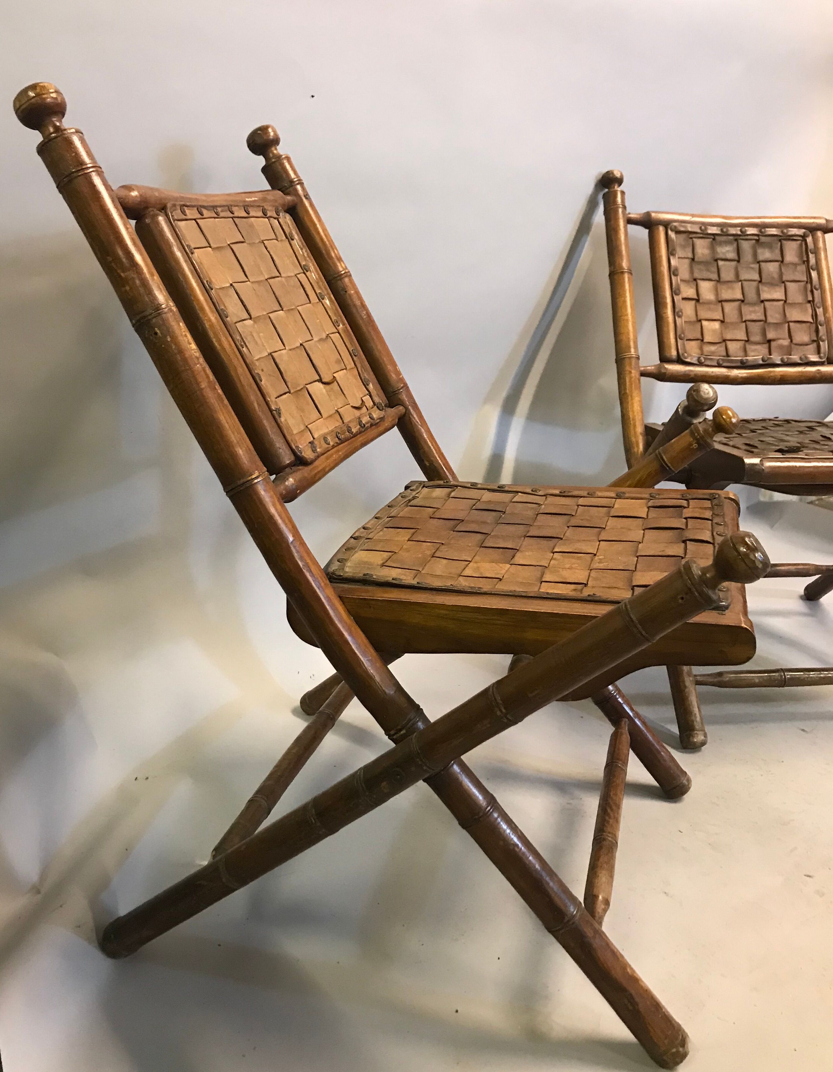 Former colonial armchairs in braided leather