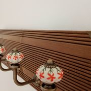 Vintage wall coat rack with 5 ceramic hooks featuring floral patterns - wood