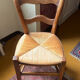Old rustic wooden chair – carved backrest – seat in fibres