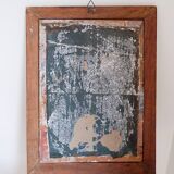 Huile sur toile - non signée - représente une femme assise à côté d'un vase de fleurs.