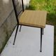 Black metal chair and yellow imitation leather seat
