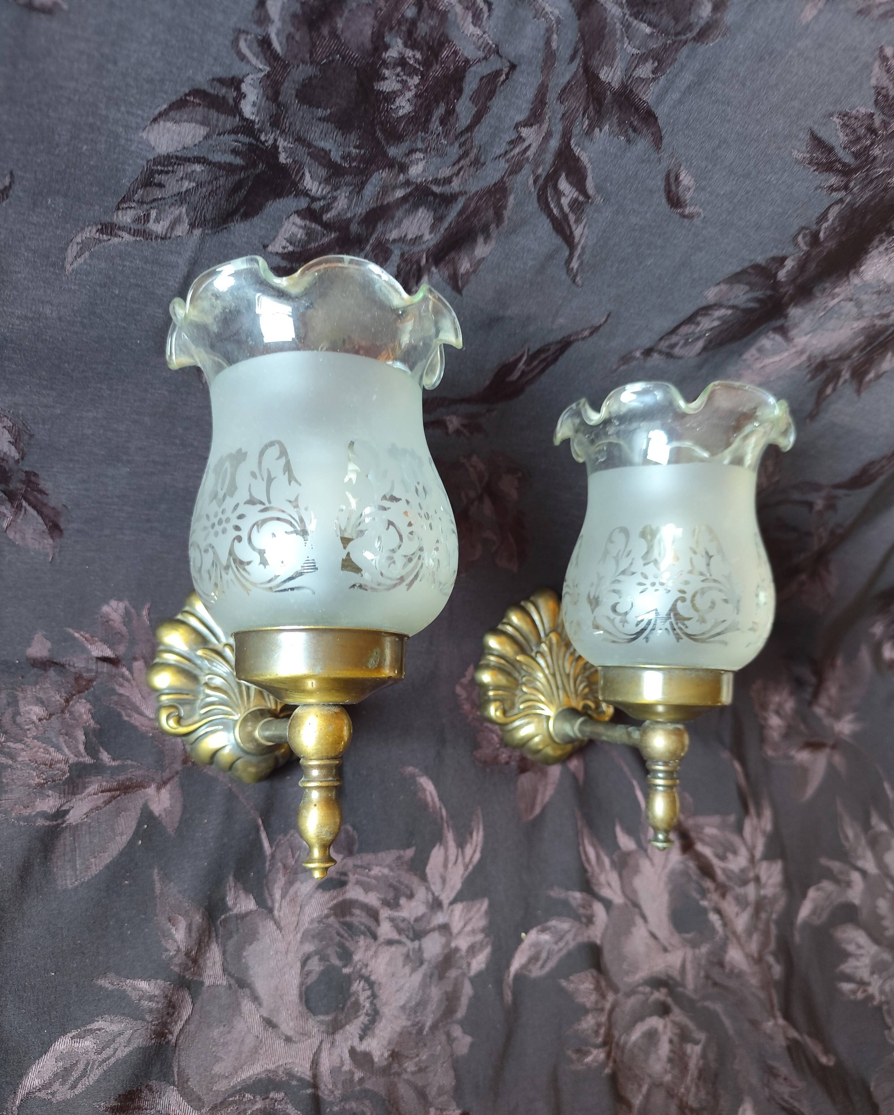 Pair of wall sconces in bronze with opaline glass tulips.