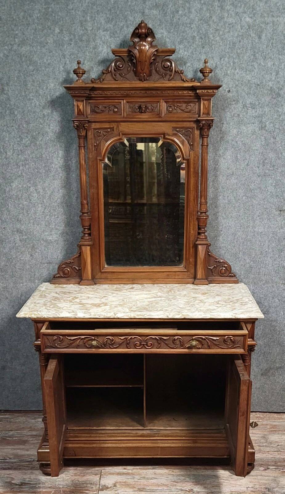 Buffet with mirror in Renaissance style, entirely made of solid walnut.