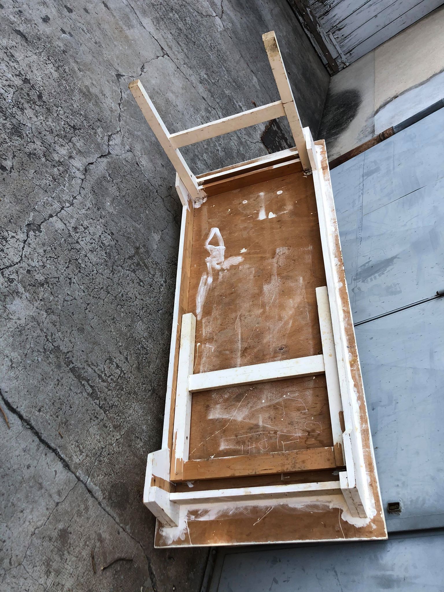 Old table in foldable wood painted white