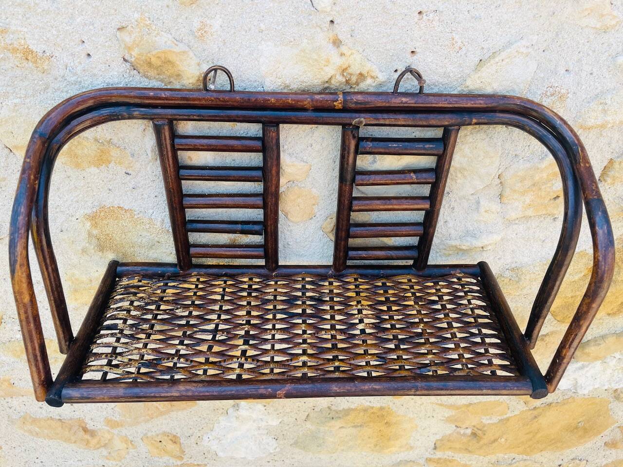 Vintage wall shelf in bamboo and rattan, circa 1960s.