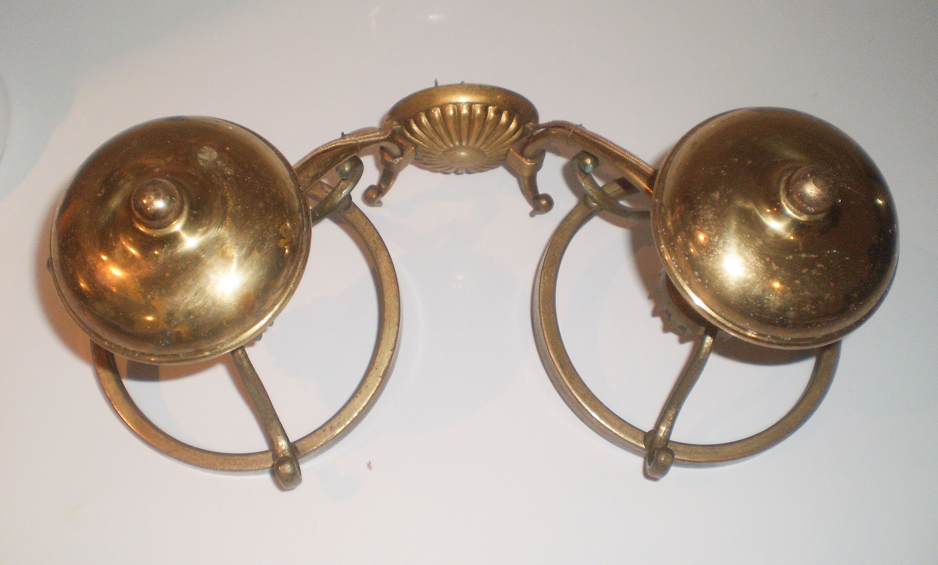 Glass brass globe sconce