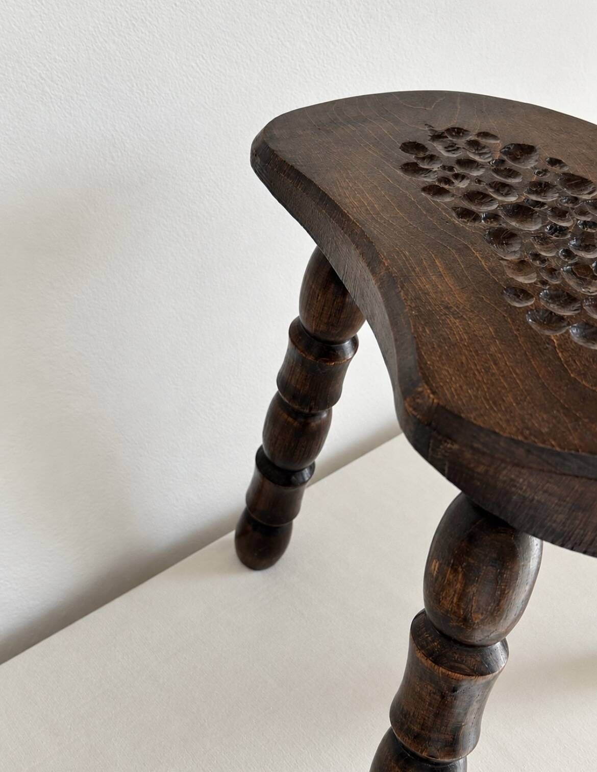 Restored dark wood tripod stool, bobbin leg, elegant furniture.