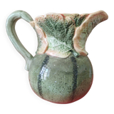 Green pitcher with zucchini patterns