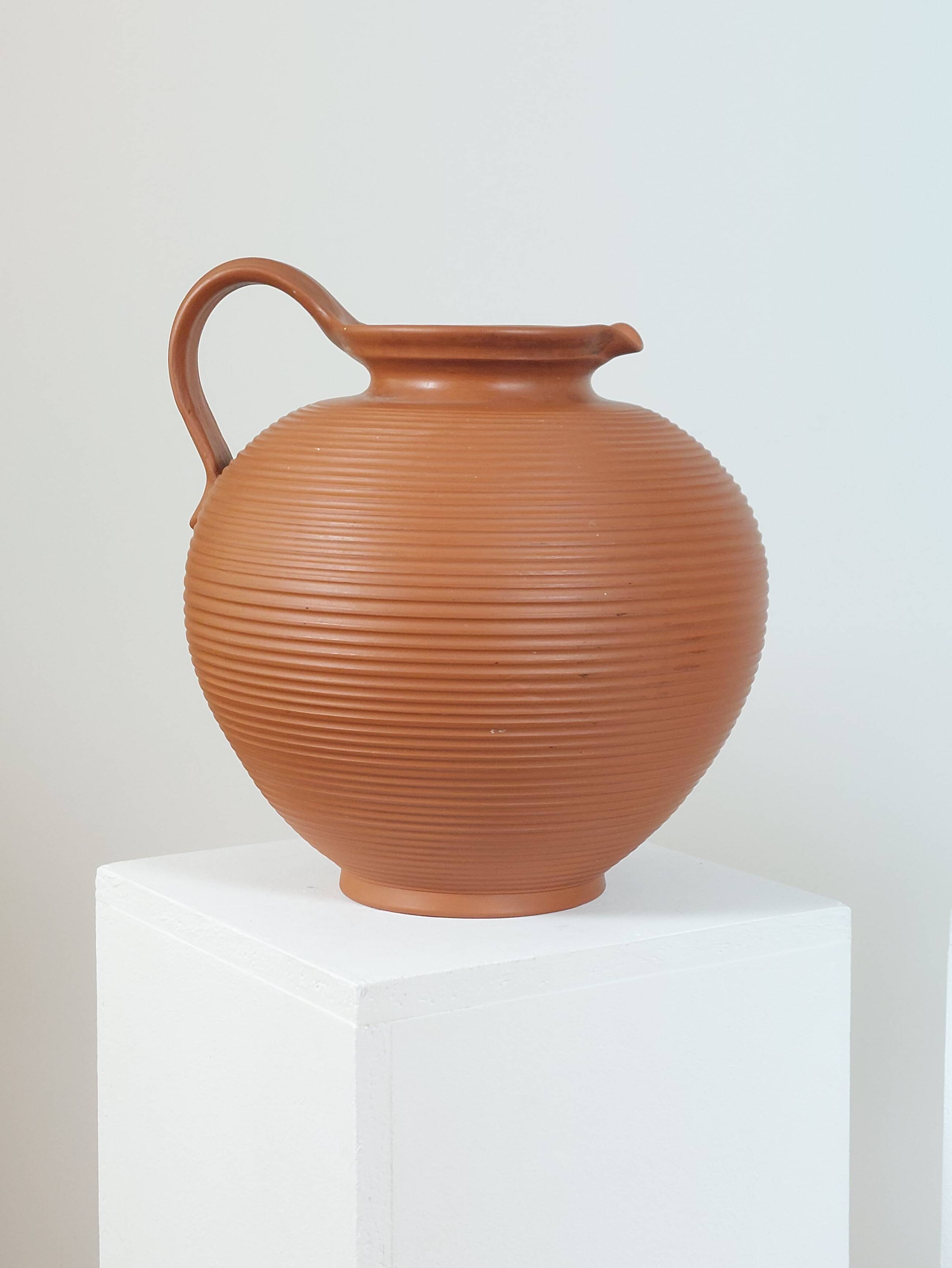 Pair of handcrafted terracotta vases from the mid-century.