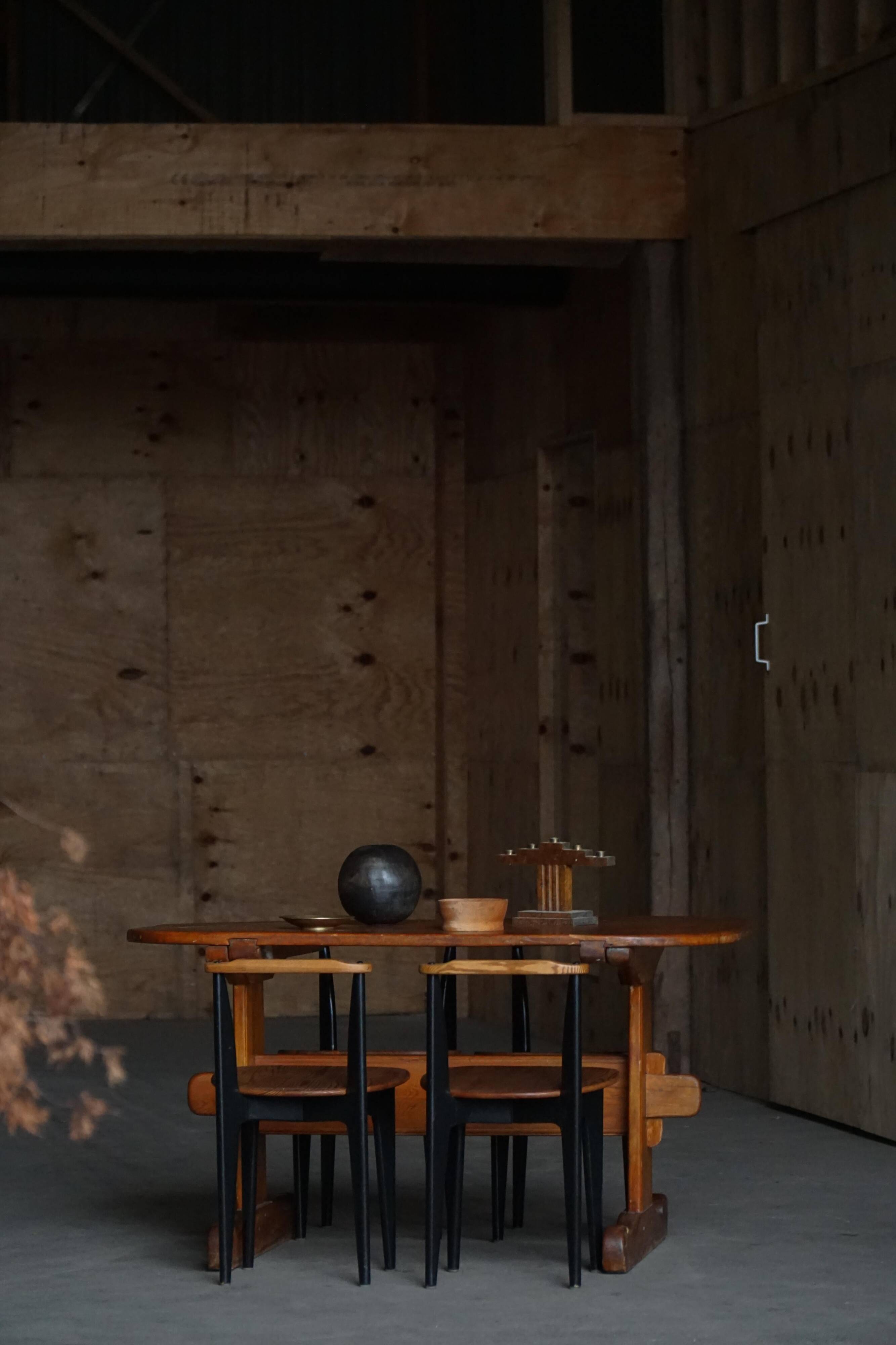 Primitive Swedish oval dining table in pine, early 20th century.