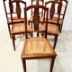 Set of six Art Deco chairs in solid walnut, 20th century.