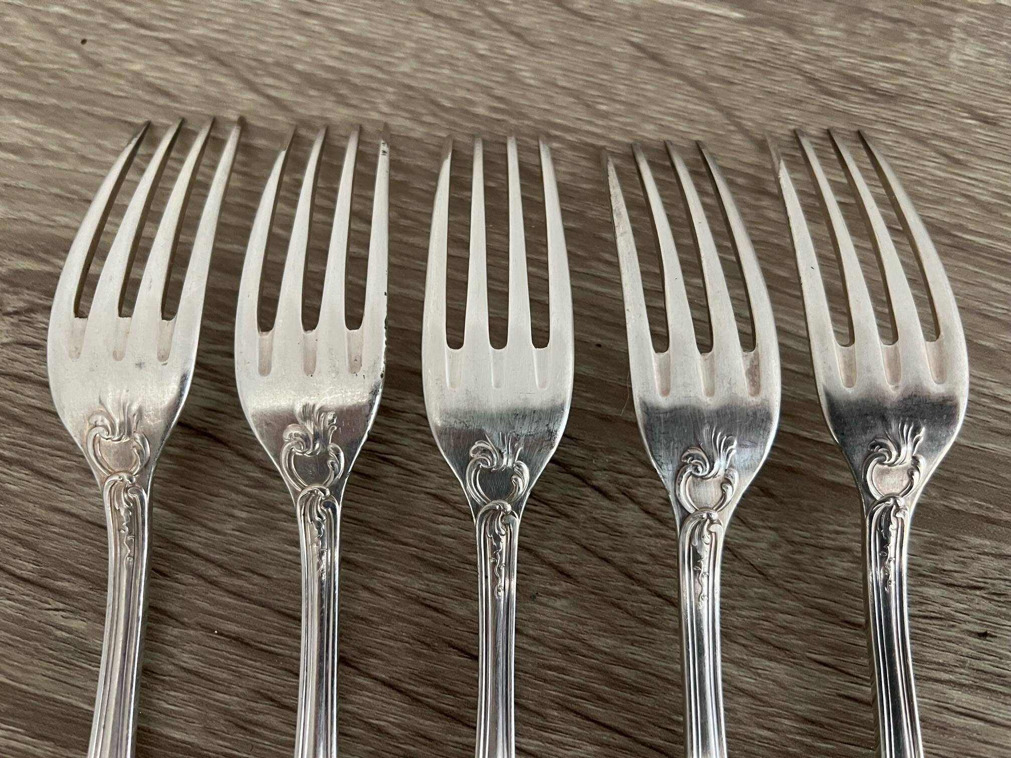 5 silver-plated metal forks with the Ercuis hallmark.