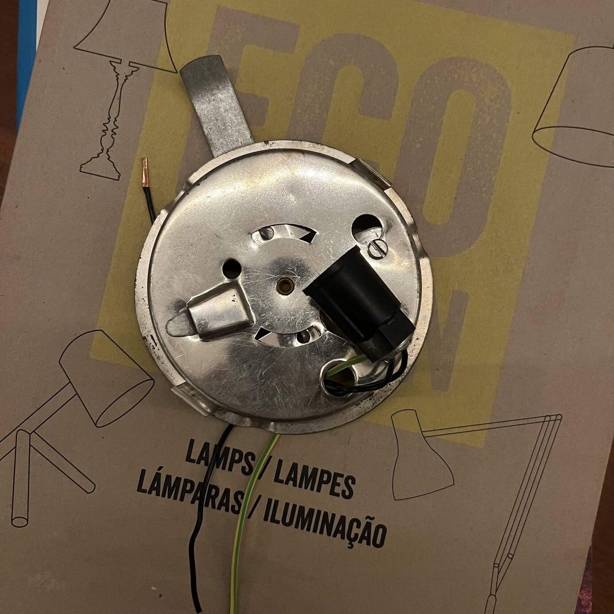 Small antique ceiling light or wall sconce with white opaline glass in a half-moon shape.