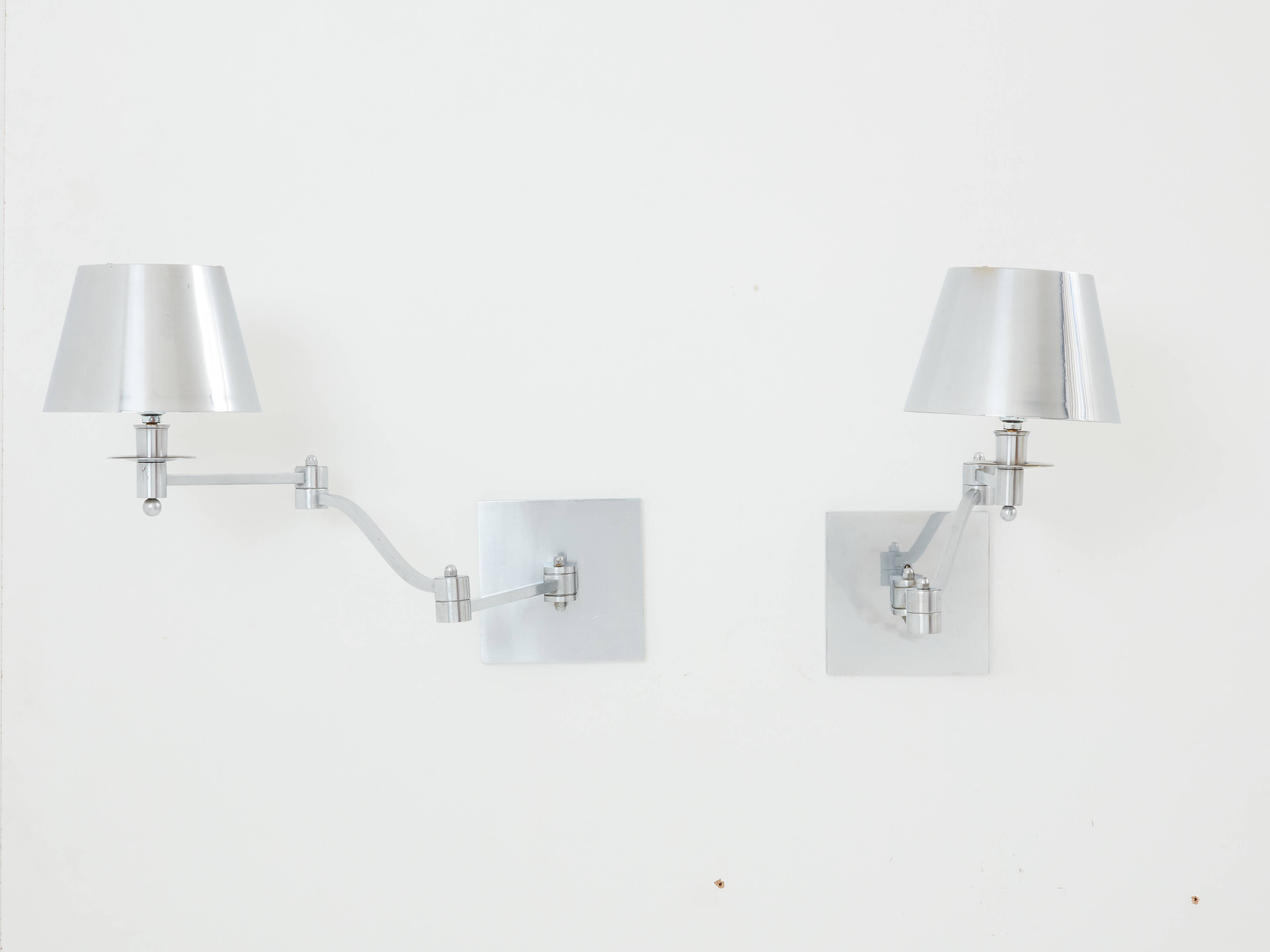 Pair of Maison Charles adjustable brushed steel wall lights circa 1960