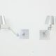Paire d’appliques ajustables Maison Charles acier brossé vers 1960