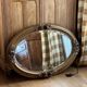 Oval gold mirror