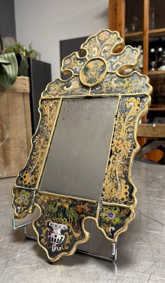 Eglomise glass mirror with scrollwork and branch races decoration